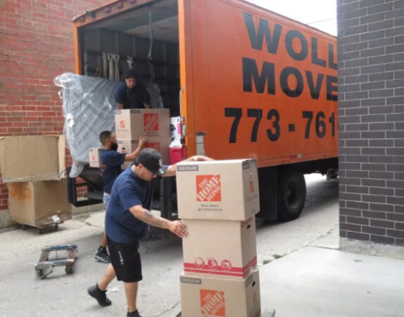Wolley Movers workers safely unloading a truck