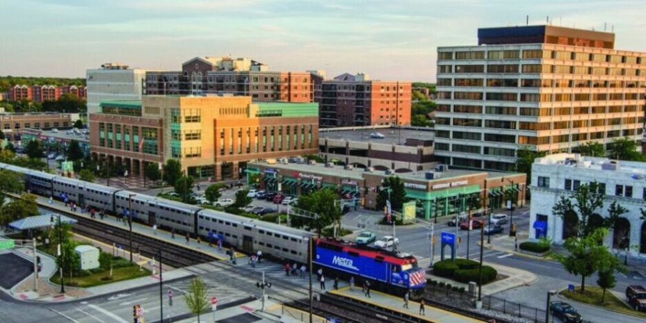 view of Des Plaines with train and apartments, one of Wolley Movers' service areas